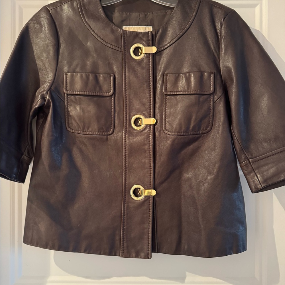 Michael Kors Brown Leather Jacket with Gold Details like new.